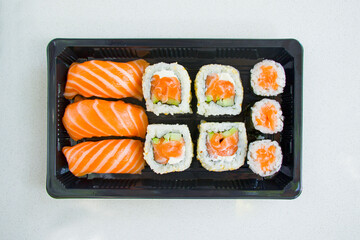 California sushi rolls set on the stone plate, sushi delivery set