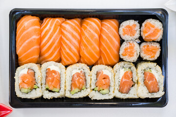 California sushi rolls set on the stone plate, sushi delivery set