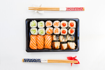 California an eel fish sushi rolls set on the stone plate, sushi delivery set