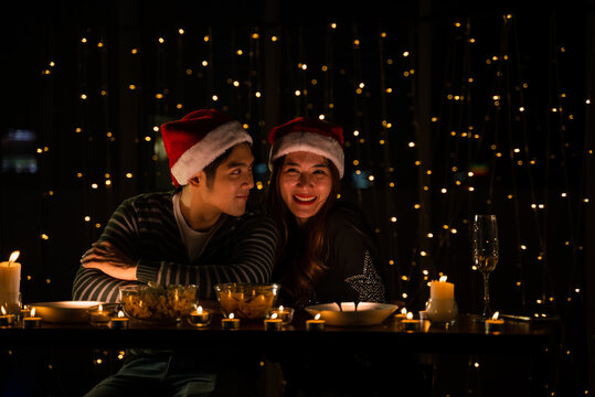 Young Couple Celebrate At Night Party, Romance Date And Love Concept For Valentine's Day, Dinner With Night Candle Light, Cozy With Couple Family At Home