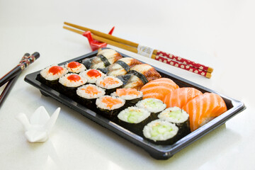 California an eel fish sushi rolls set on the stone plate, sushi delivery set