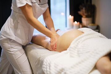 masseur makes anticellulite massage young woman in the spa salon. Body care concept. Special anticellulite treatment.
