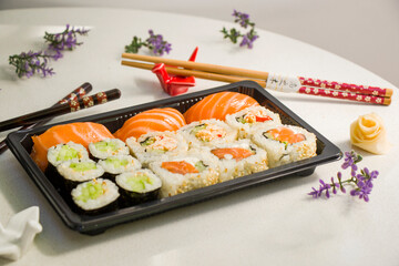 California sushi rolls set on the stone plate, sushi delivery set