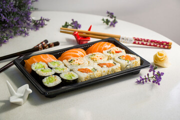 California sushi rolls set on the stone plate, sushi delivery set