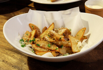 Close up deep fried potato wedge fries