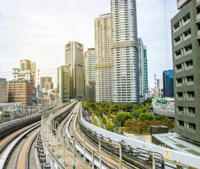 Fototapeta na wymiar Monorail in Tokyo. Skyscrapers, urban landscape