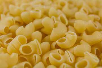 Italian pasta made from flour sprinkled on the table in large quantities