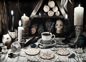 Fortunte telling ritual with magic objects, candles and crystals.