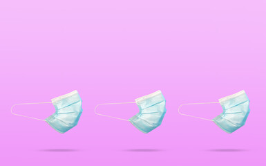 Surgical Covid-19 mask on pink background