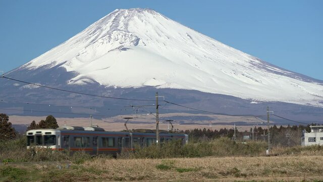 Countryside scenery. Railroad and Mt. Fuji.