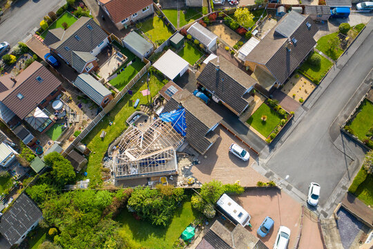 Aerial photo of a typical british housing esate in the Village of Kippax in Leeds West Yorkshire, suburban housing estates and road in the village showing an extension being built on a property