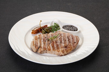 Grilled pork steak with pepper sauce