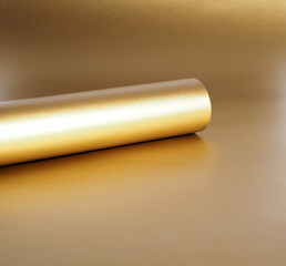 Gold paper rolled up in a tube, in a circle, abstract background for the design