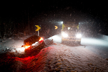 Slippery road leads to car accident in winter storm - obrazy, fototapety, plakaty