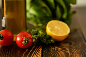 fresh herbs and vegetables on the wooden background