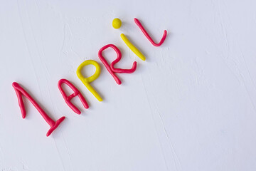 Funny font April Fools' Day, written in plasticine. Fools day phrase from plasticine, letters on white background