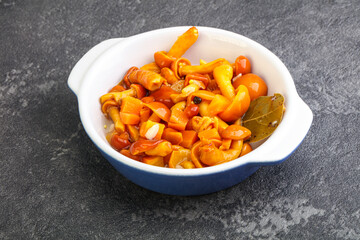 Marinated pickled honey mushrooms in the bowl