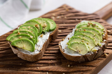 sliced avocado on toast bread with nuts