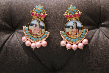 Pair of black metal earring on Black Background