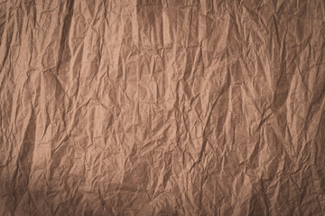 Background Of Brown Crumpled Paper With Vignete.
