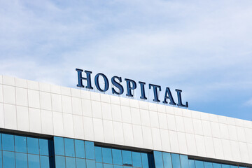 Close-up of building facade with Hospital word signage