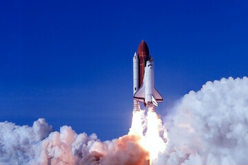 Take off space rocket on a background of blue sky and sun. Elements of this image were furnished by NASA