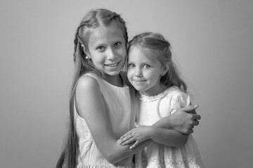 two sisters. sisters embrace each other. Black and white