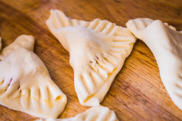 preparation of pretzels with cheese and mortadella cooked in the oven