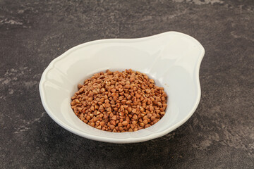Raw buсkwheat cereal in the bowl