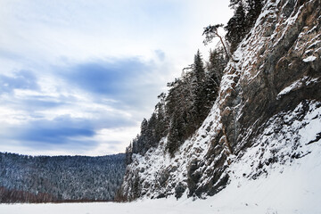 Winter landscape, rocks and forest, Siberia, Mana river. Hike