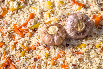 Cooking pilaf in a cauldron close-up as a background. National Asian food. Uzbek pilaf.