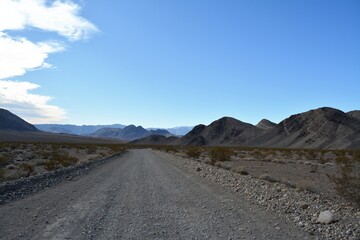 Fototapeta na wymiar road trip over loose gravel on Racetrack road to the Race Track Playa at the northern end of the Death Valley National Park in December California