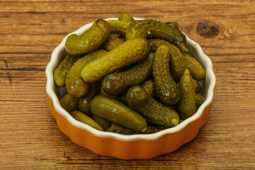 Pickled gherkin in the bowl