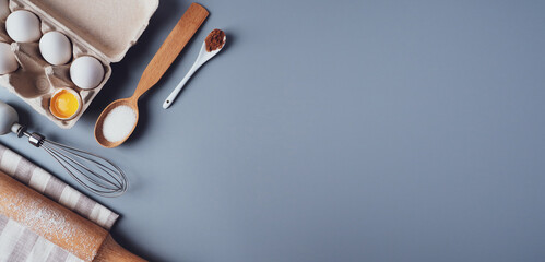 Banner, Flat Lay composition, ingredients for baking cookies on a gray background, copy space....
