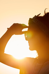 Fototapeta na wymiar Silhouette of a woman in sunset sunrise time.