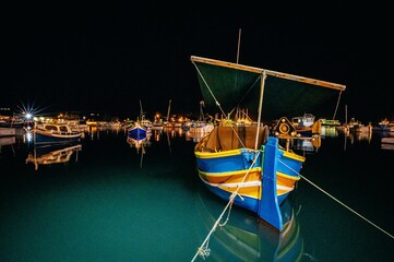 Fototapeta na wymiar boats in the harbor at night in Malta