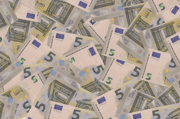 5 euro bills lies in big pile. Rich life conceptual background