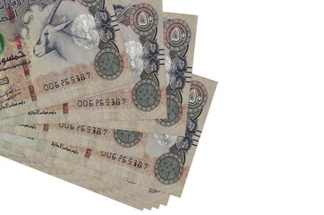 50 UAE dirhams bills lies in small bunch or pack isolated on white. Mockup with copy space. Business and currency exchange
