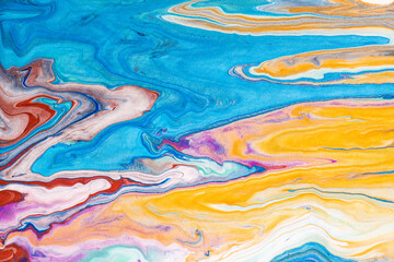 Abstract liquid art painting. Pattern with abstract blue, gold and red waves. Marble. Handmade surface. Liquid paint. Acrylic wallpaper. Mineral cosmos texture.