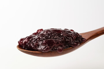 Grape jam on a white background
