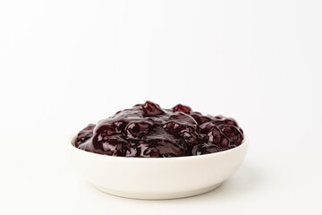 Grape jam on a white background