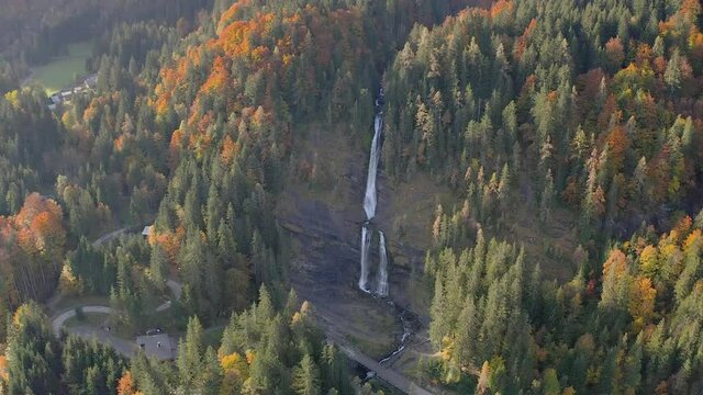 Cascade du Rouget Waterfall Between Forest In Autumn Season At Daytime In Sixt-Fer-a-Cheval, France. - aerial