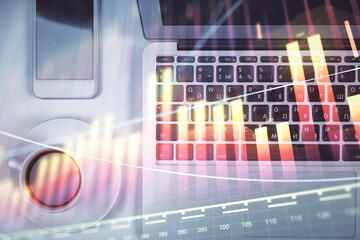 Stock market chart and top view computer on the table background. Multi exposure. Concept of financial analysis.