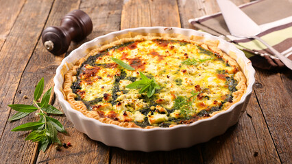 vegetarian quiche on wood background
