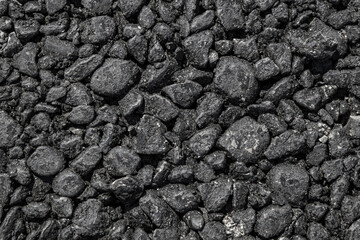 Coarse asphalt as an abstract background.Close-up.