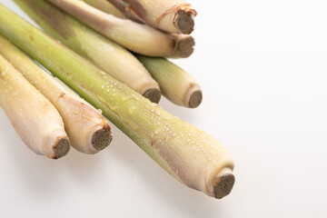 cut lemongrass stems in close up on white background 