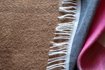 Multicolored fabric with fringe, textile background