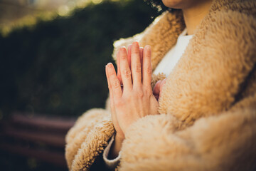 Woman meditating in park.