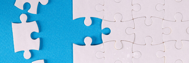 Folded white jigsaw puzzles blue background business Challenges and solutions concept