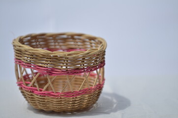 A single handmade small rattan basket on white background